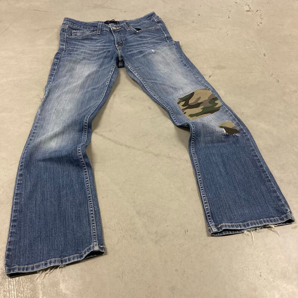 Low rise Levi’s camo patchwork bootcut jeans 31x30